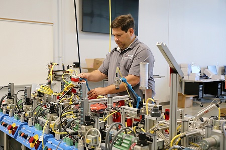 Mechatronics Technology instructor Ben Harris works on a miniature assembly line station used to train students in the new Mechatronics Technology program that will be offered at East Mississippi Community College’s Communiversity where registration is underway for classes that begin in August. Mechatronics Technology instructor Ben Harris works on a miniature assembly line station used to train students in the new Mechatronics Technology program that will be offered at East Mississippi Community College’s Communiversity where registration is underway for classes that begin in August.
